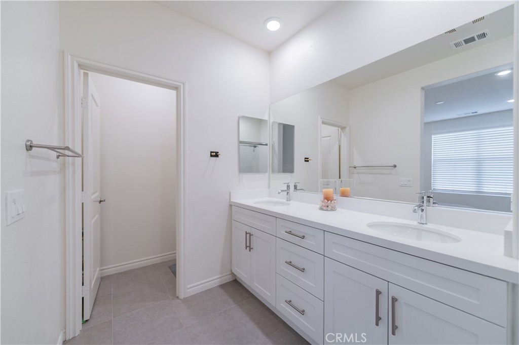 2425 Villena Way Placentia, CA 92870 - Photo 22 of 35 a bathroom with a sink and a mirror