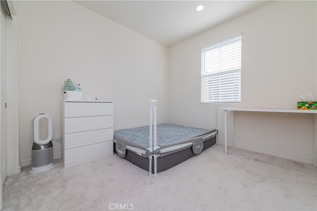 2425 Villena Way Placentia, CA 92870 - Photo 25 of 35 a bedroom with a bed and a window