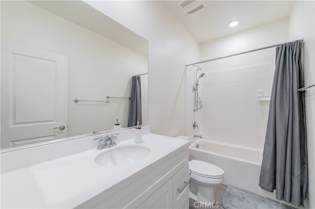 2425 Villena Way Placentia, CA 92870 - Photo 26 of 35 a bathroom with a granite countertop sink toilet and shower