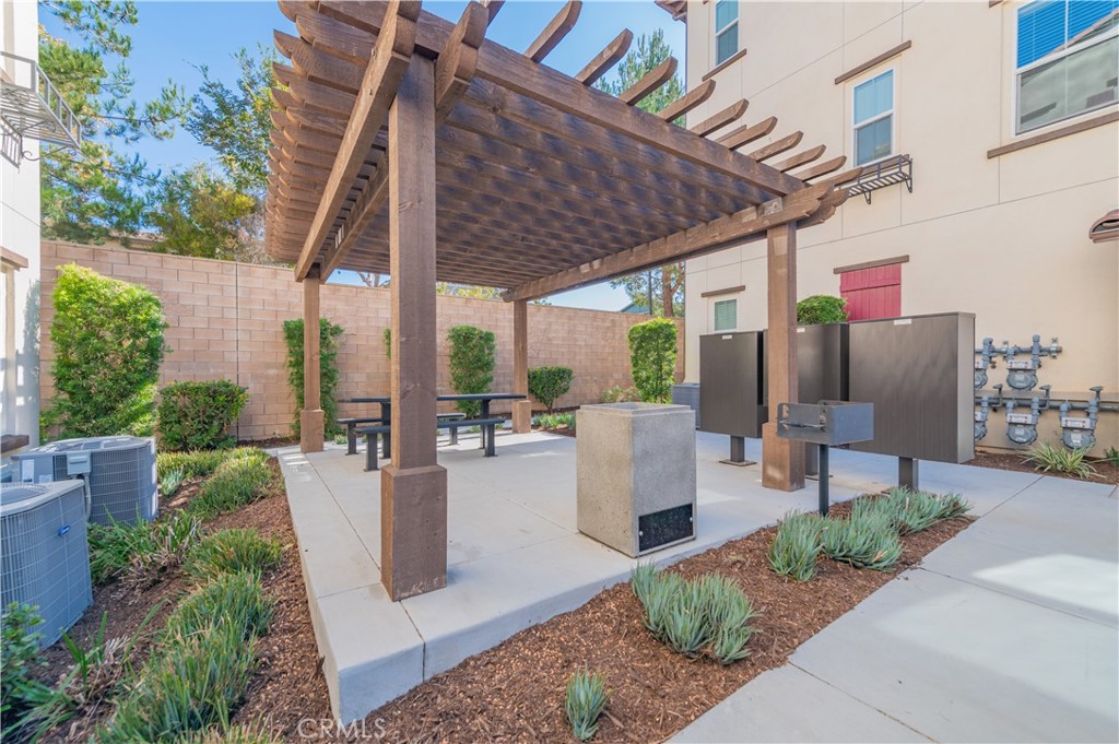 2425 Villena Way Placentia, CA 92870 - Photo 35 of 35 a view of a patio with couches table and chairs and potted plants