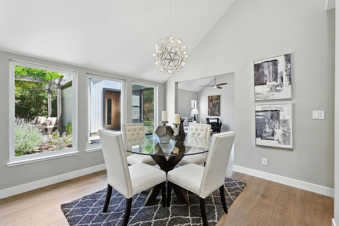 148 Promethean Way Mountain View, CA 94043 - Photo 12 of 45 a view of a dining room with furniture wooden floor and a chandelier