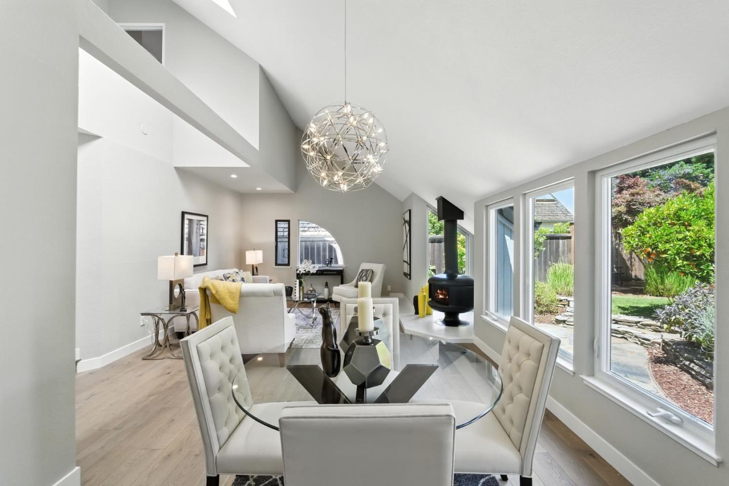 148 Promethean Way Mountain View, CA 94043 - Photo 13 of 45 a view of a dining room with furniture a chandelier and large windows