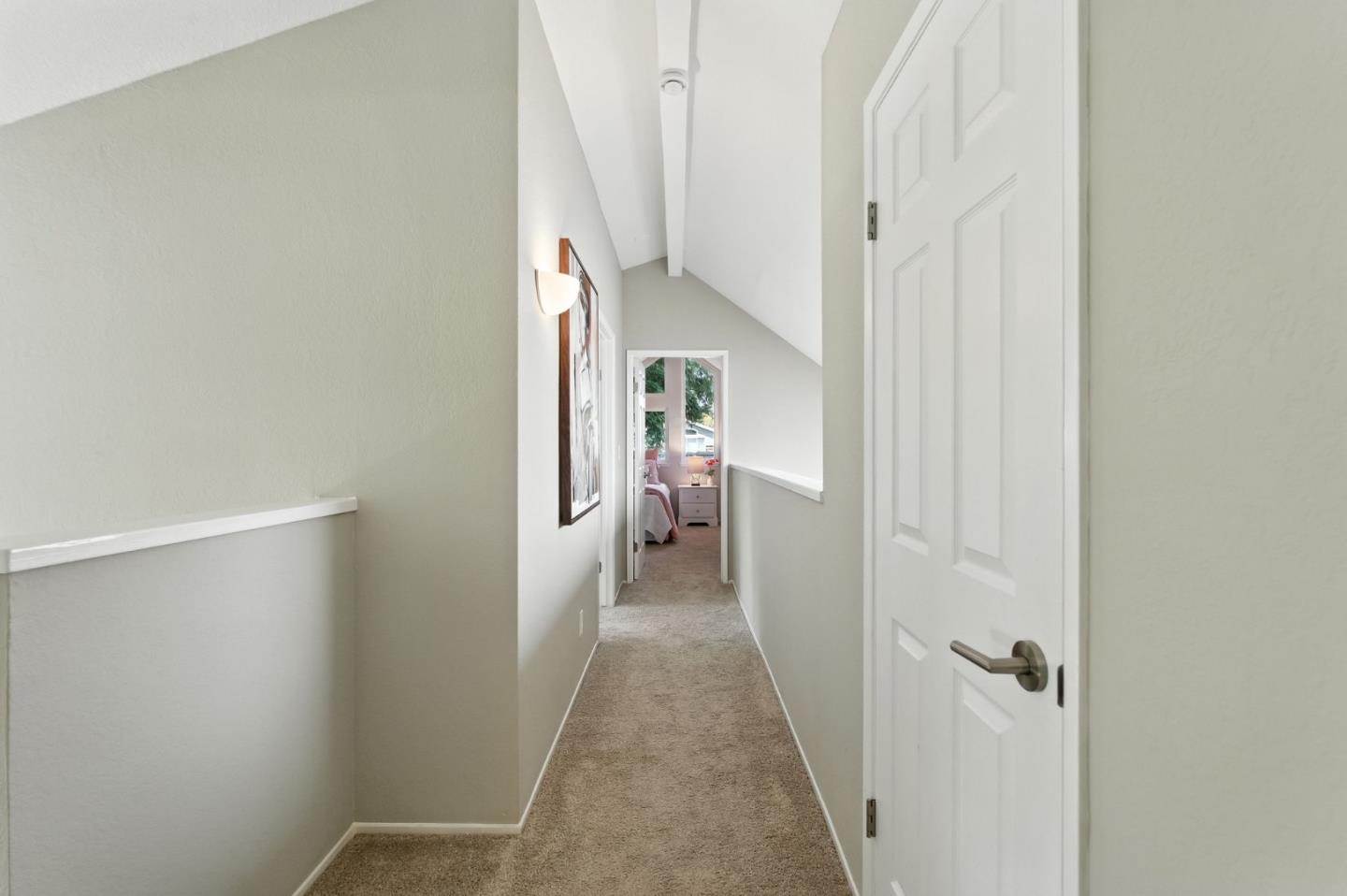 148 Promethean Way Mountain View, CA 94043 - Photo 26 of 45 a view of a hallway with wooden floor and staircase