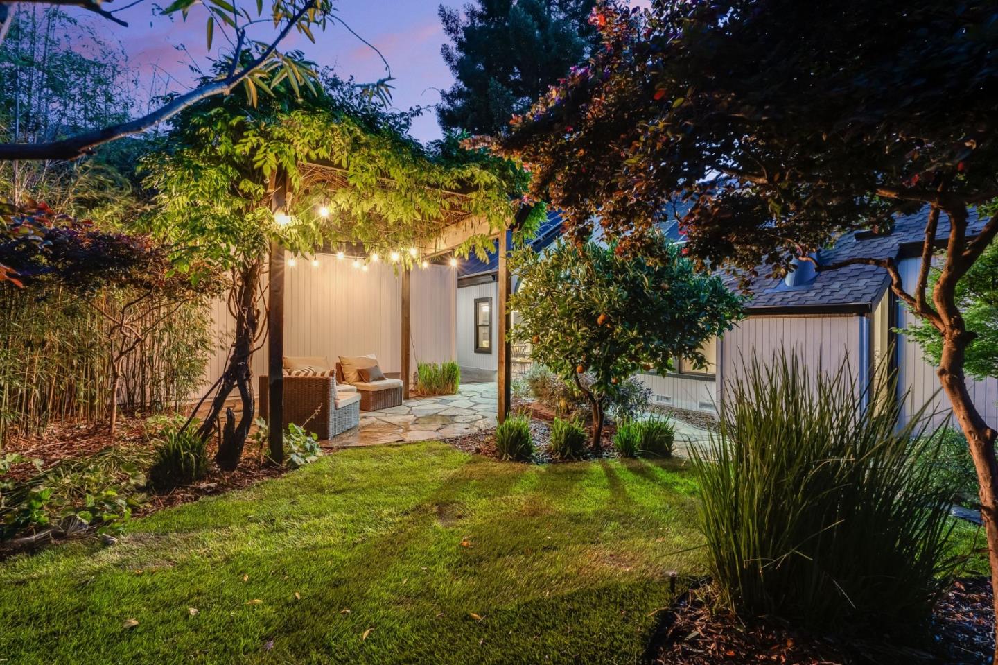 148 Promethean Way Mountain View, CA 94043 - Photo 32 of 45 a view of a backyard with plants and a bench