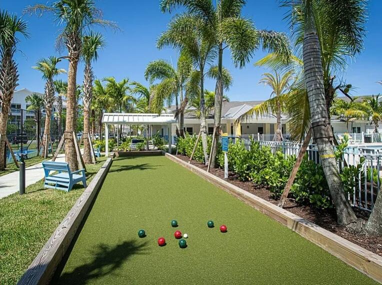 1900 Northwest Federal Highway Stuart, FL 34994 - Photo 13 of 15 a view of a swimming pool with a yard and palm trees