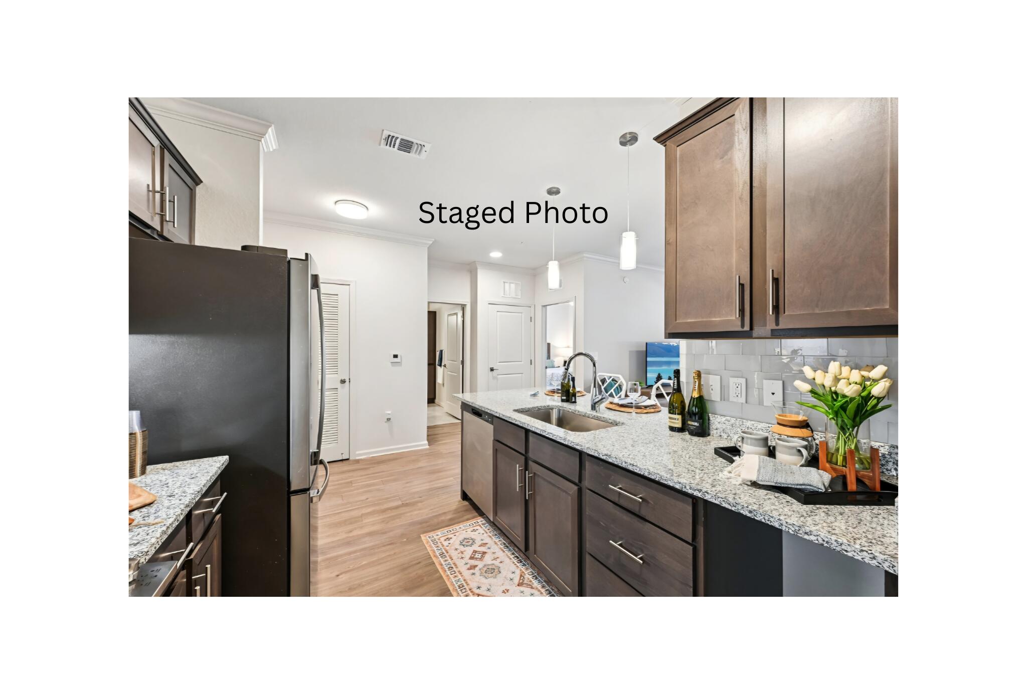 1900 Northwest Federal Highway Stuart, FL 34994 - Photo 4 of 15 a kitchen with stainless steel appliances granite countertop a refrigerator and a sink