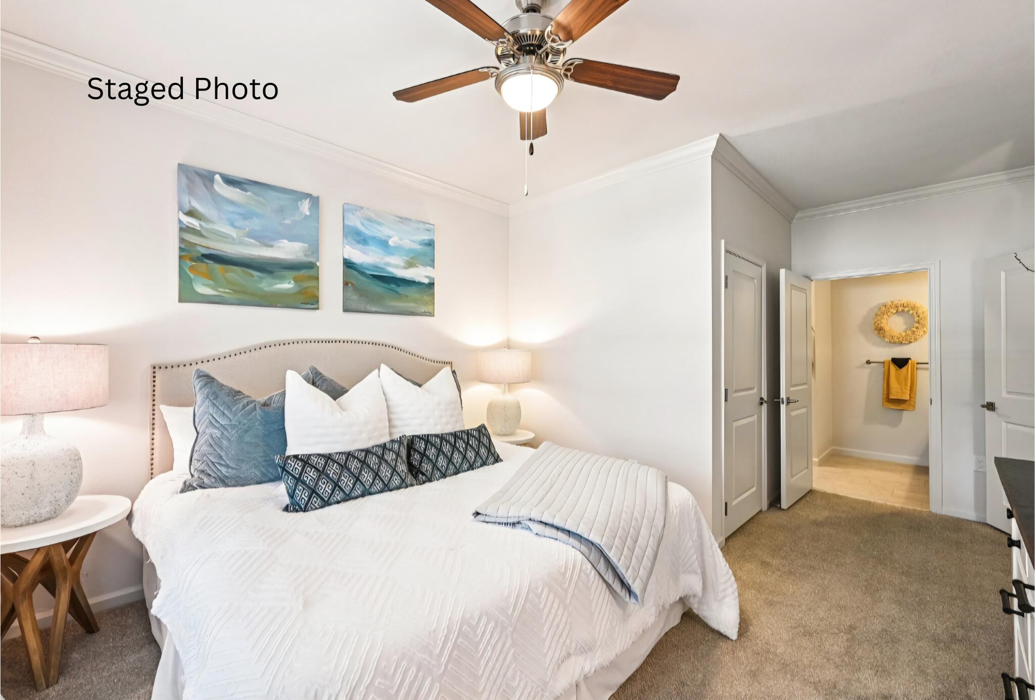1900 Northwest Federal Highway Stuart, FL 34994 - Photo 5 of 15 a bedroom with a bed and a chandelier