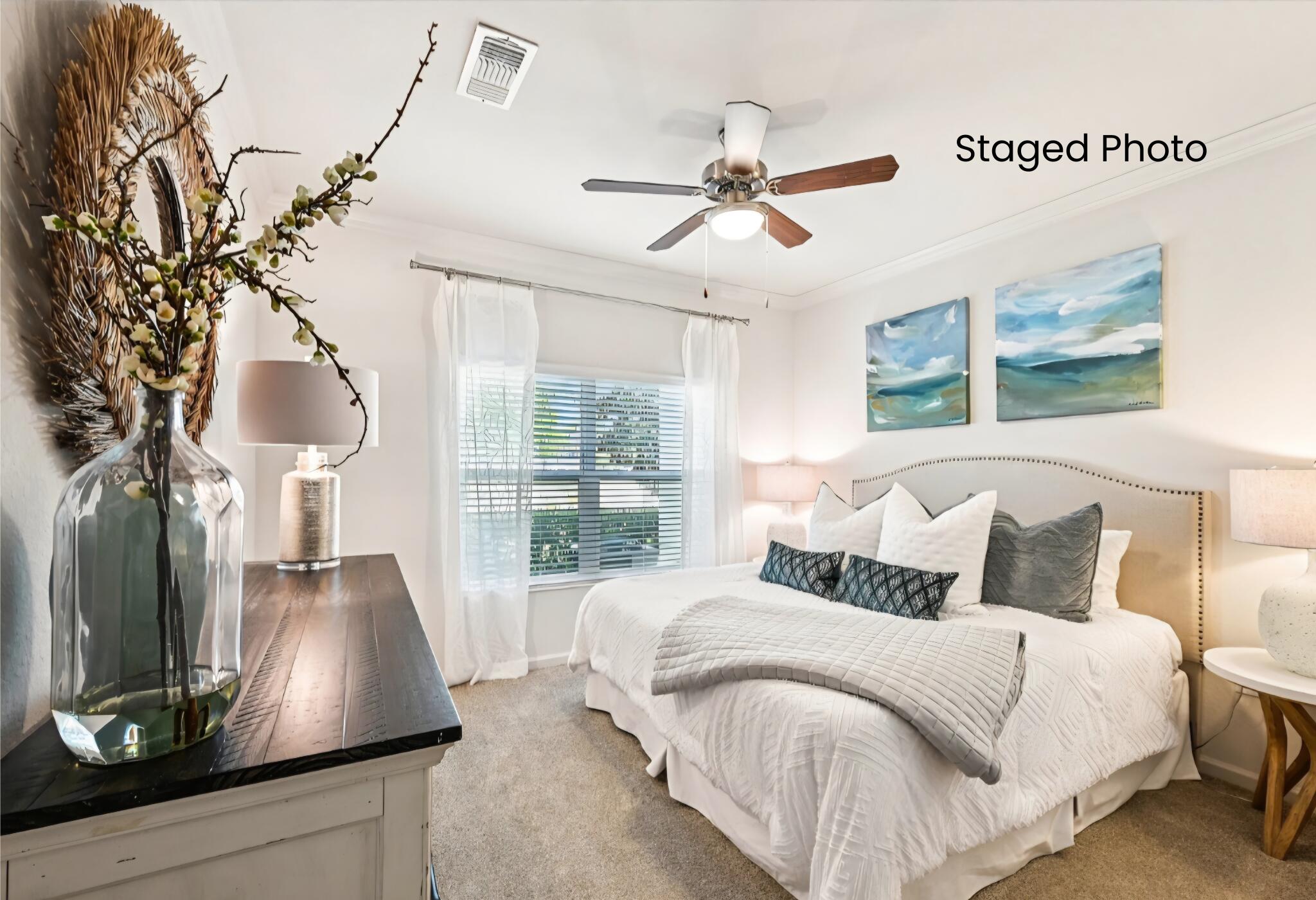 1900 Northwest Federal Highway Stuart, FL 34994 - Photo 6 of 15 a bedroom with a large bed and a chandelier