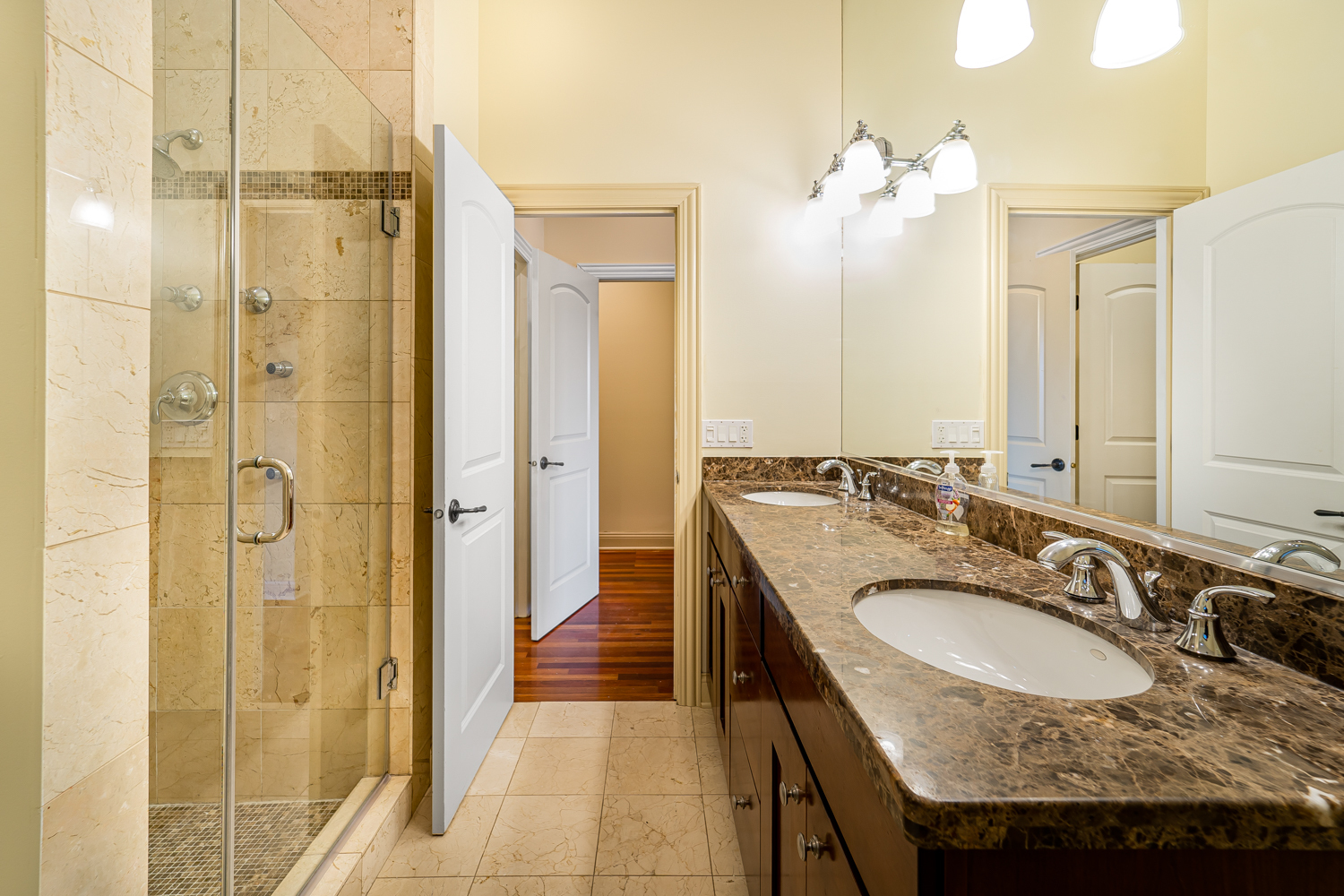 1018 South May Street, Unit F Chicago, IL 60607 - Photo 12 of 21 a bathroom with a granite countertop sink and a mirror