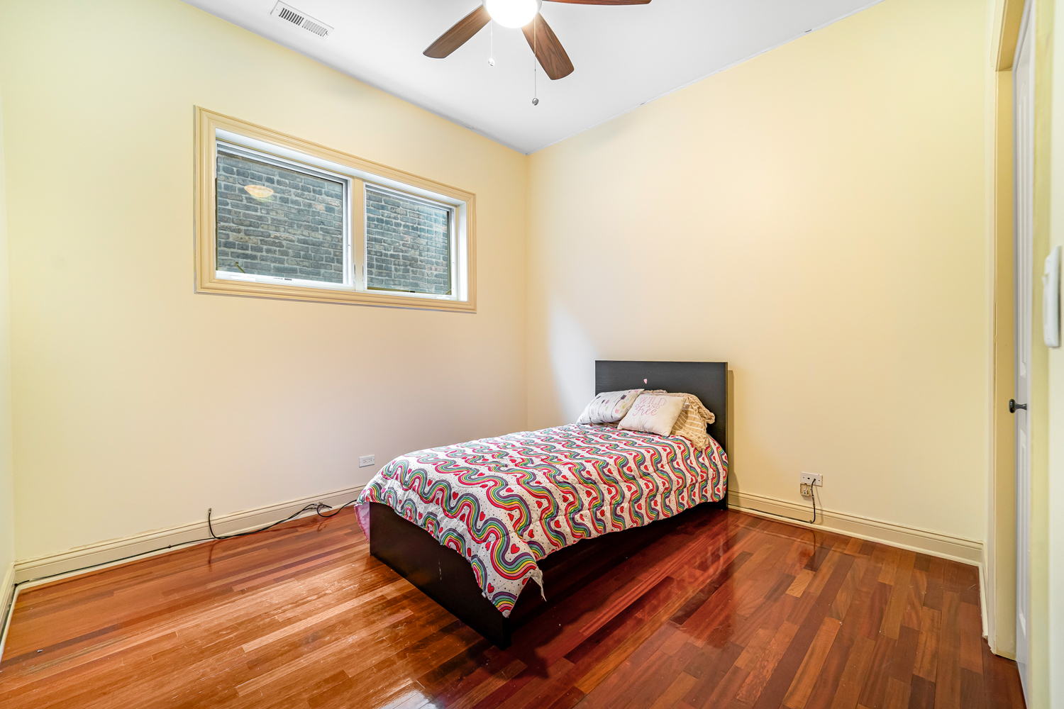 1018 South May Street, Unit F Chicago, IL 60607 - Photo 15 of 21 a bedroom with a bed and wooden floor