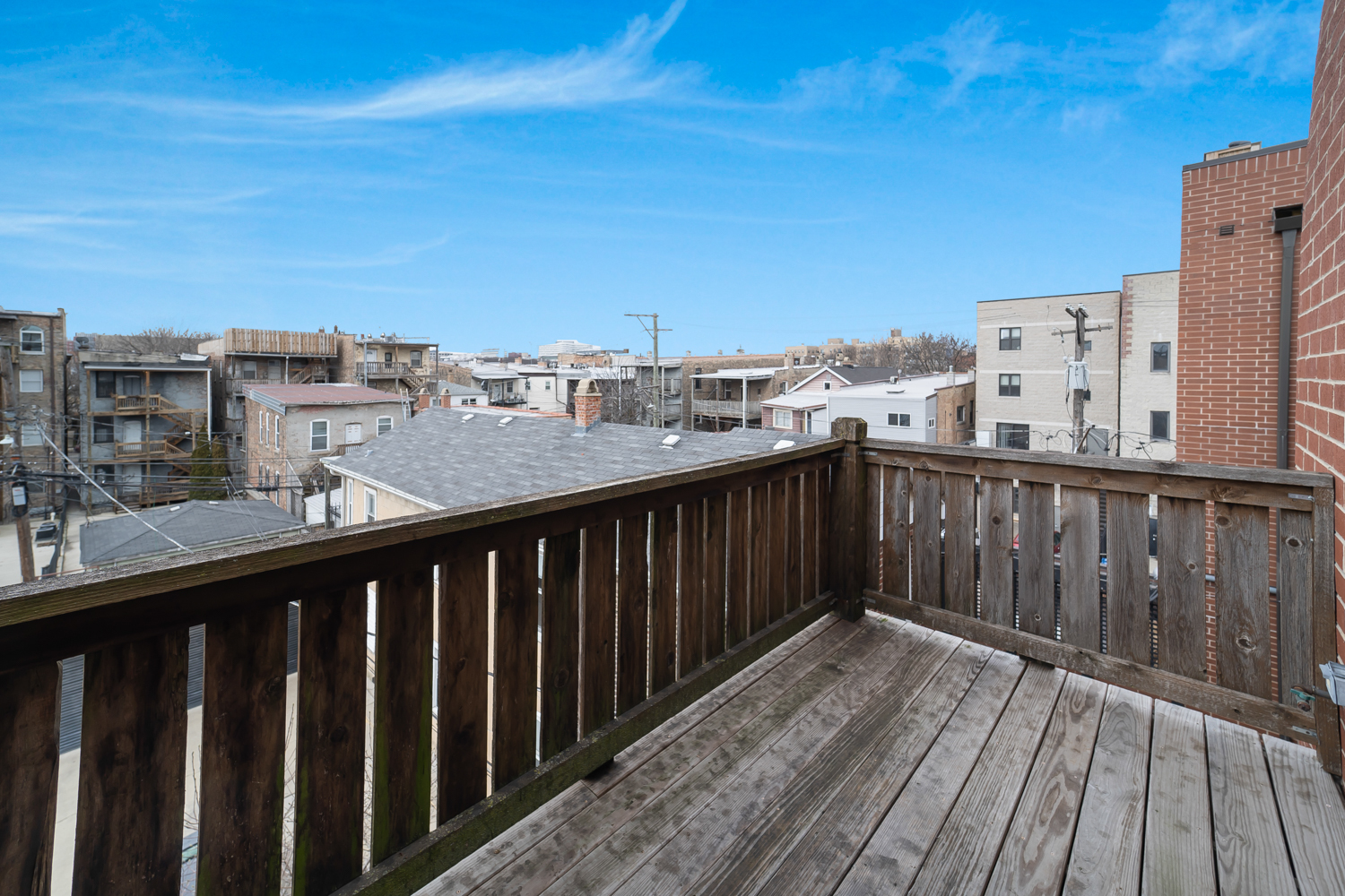 1018 South May Street, Unit F Chicago, IL 60607 - Photo 18 of 21 a balcony with wooden floor