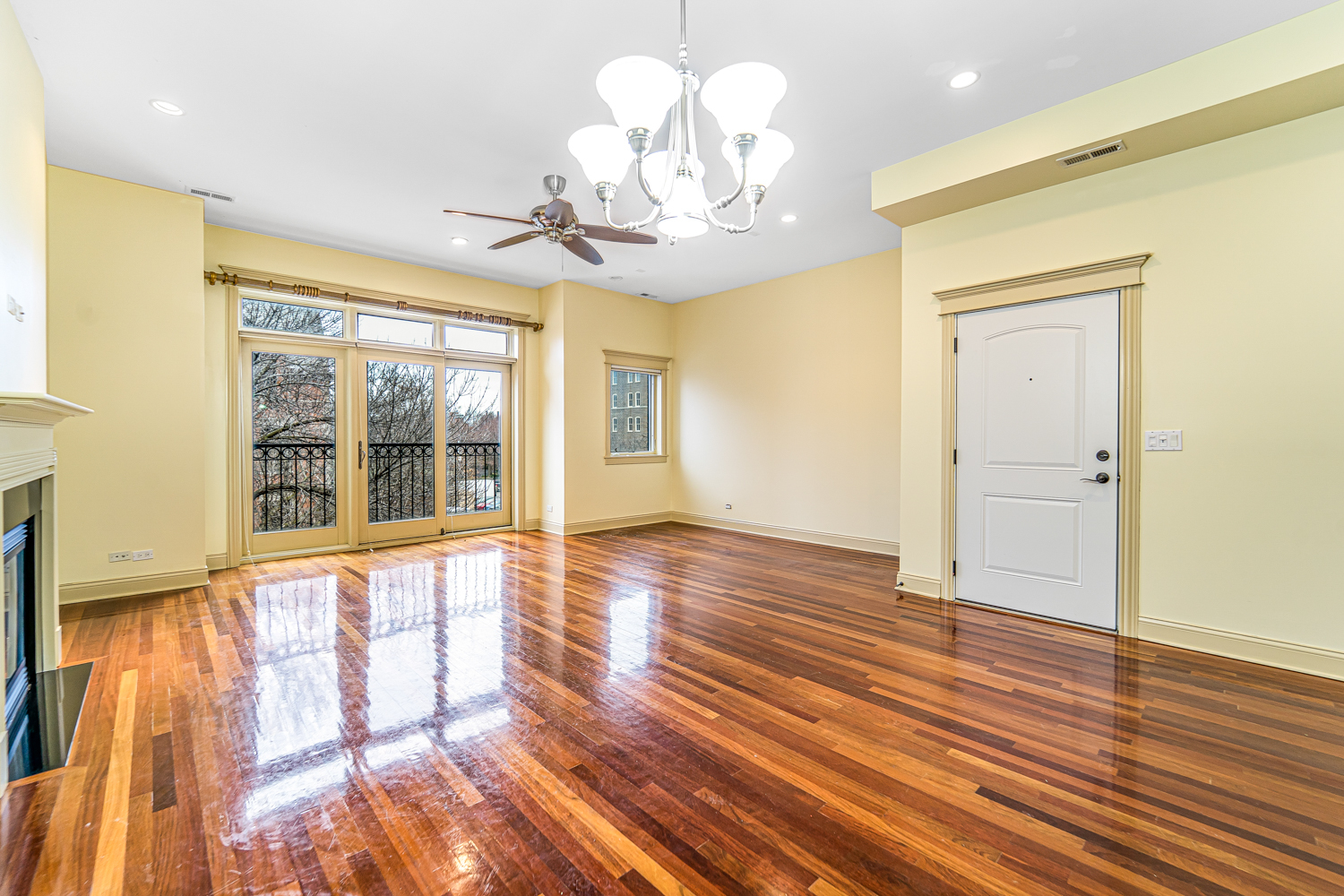 1018 South May Street, Unit F Chicago, IL 60607 - Photo 5 of 21 a view of an empty room with wooden floor and a window