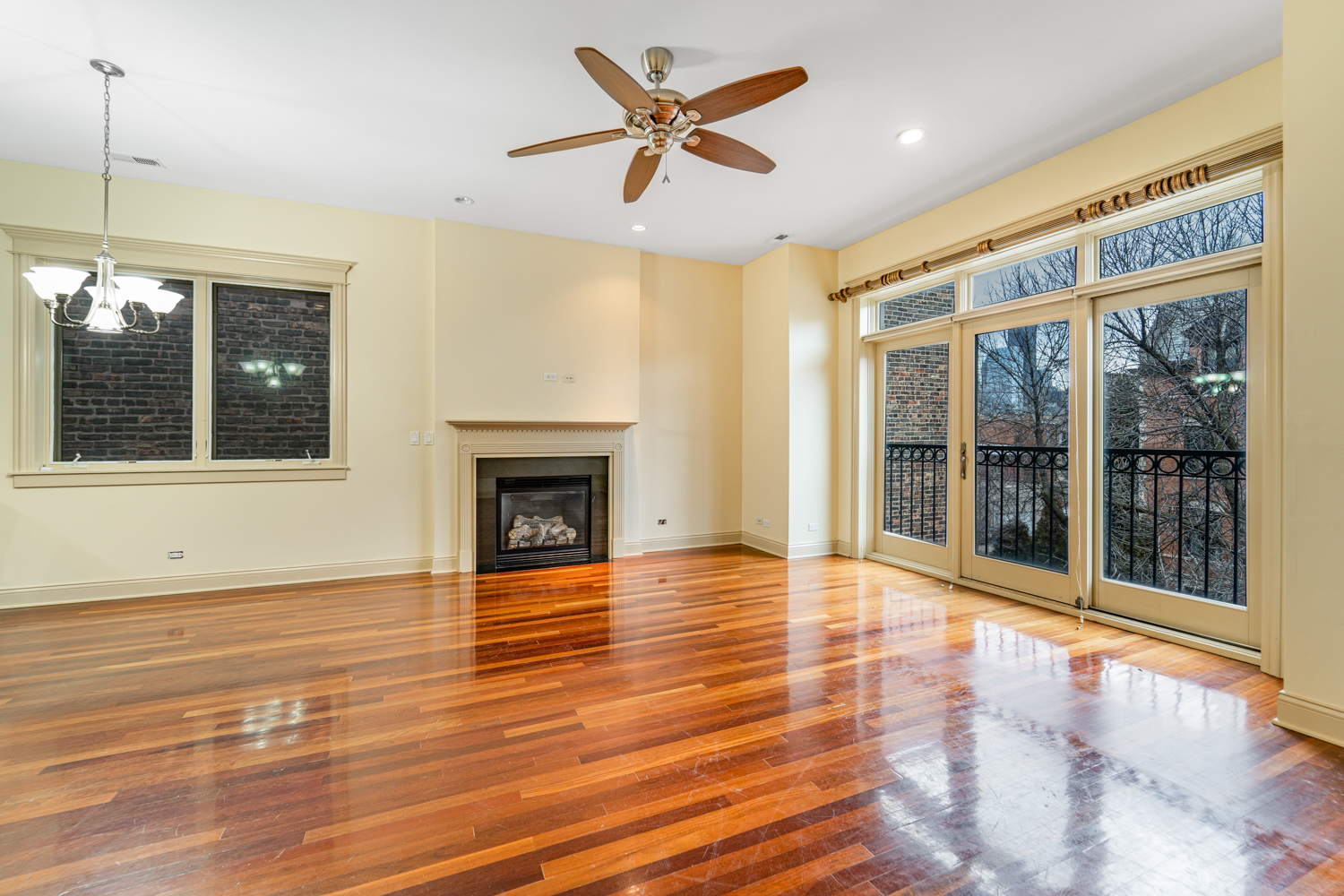 1018 South May Street, Unit F Chicago, IL 60607 - Photo 7 of 21 a view of an empty room with window and wooden floor