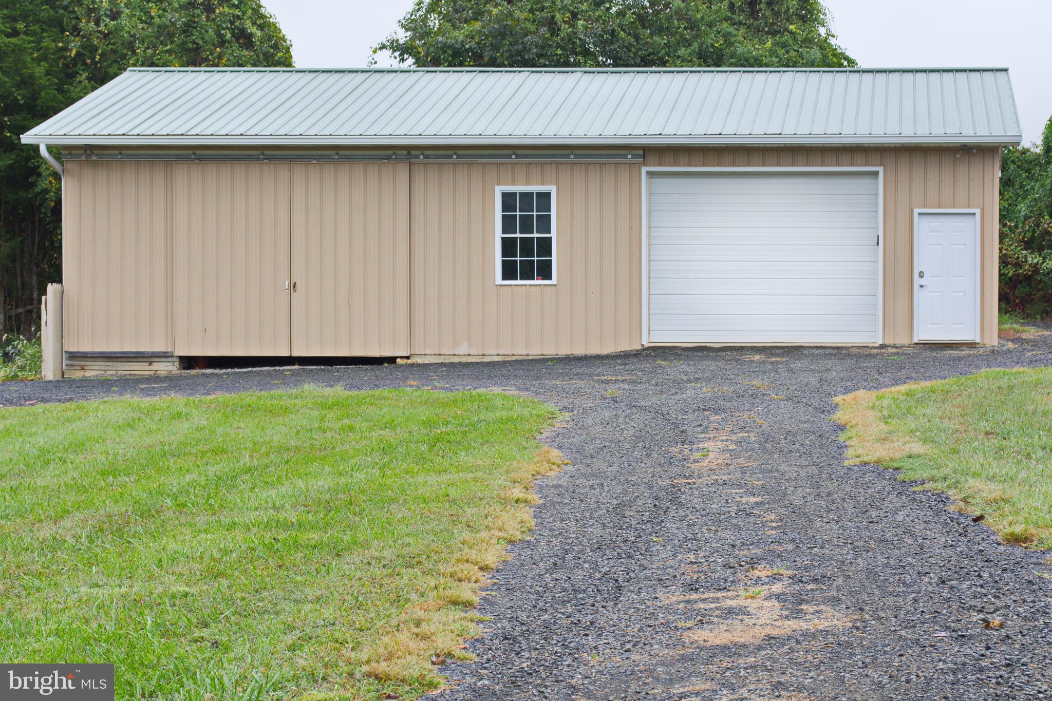 26'x48' shop. 36' insulated/heated, concrete floor