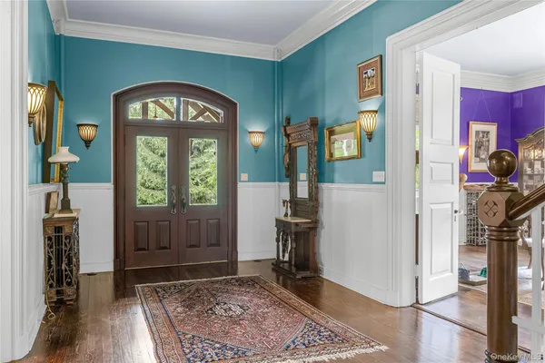 a view of an entryway with a grandfather clock
