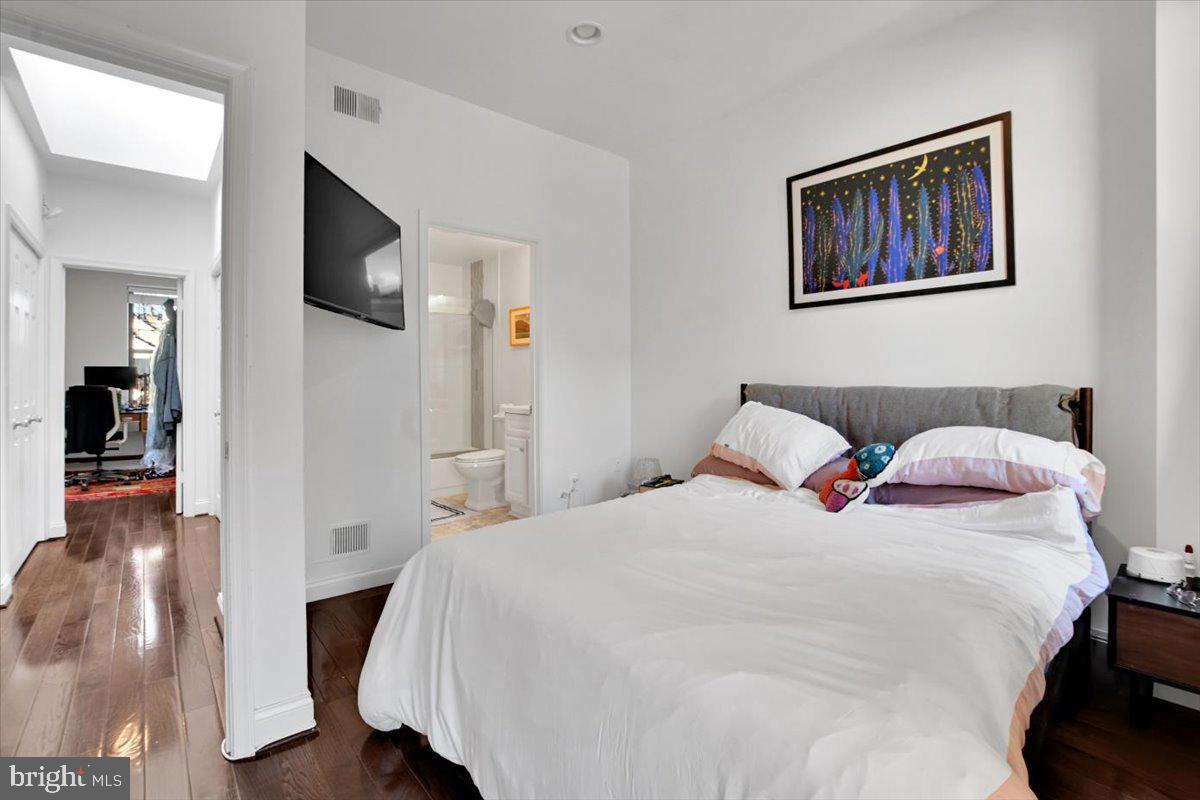 1614 15th Street Northwest Washington, DC 20009 - Photo 12 of 47 a bedroom with a bed and a painting on the wall