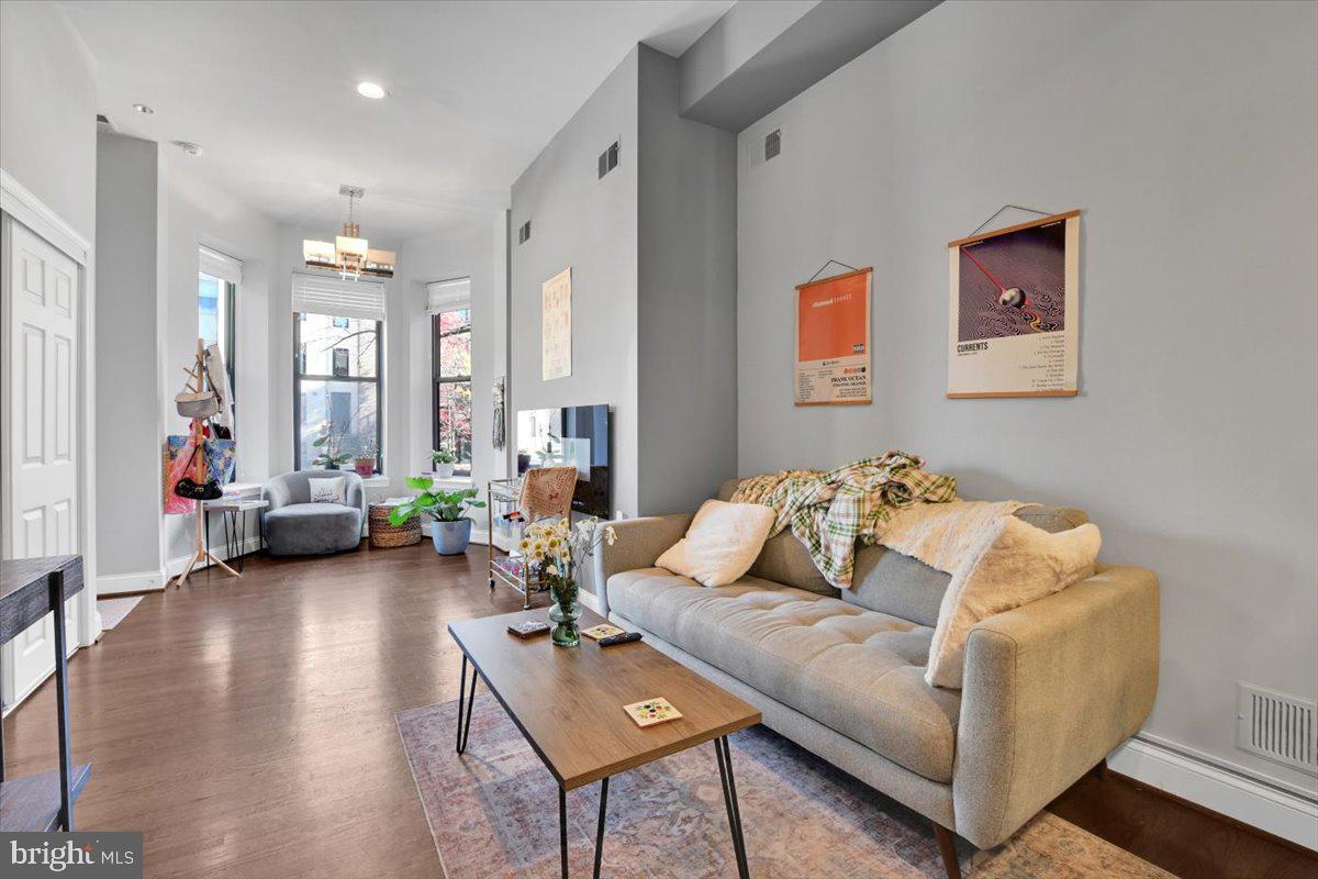 1614 15th Street Northwest Washington, DC 20009 - Photo 20 of 47 a living room with furniture and a couch