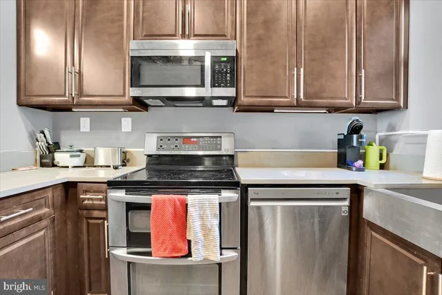 a bedroom with a bed and a view of kitchen