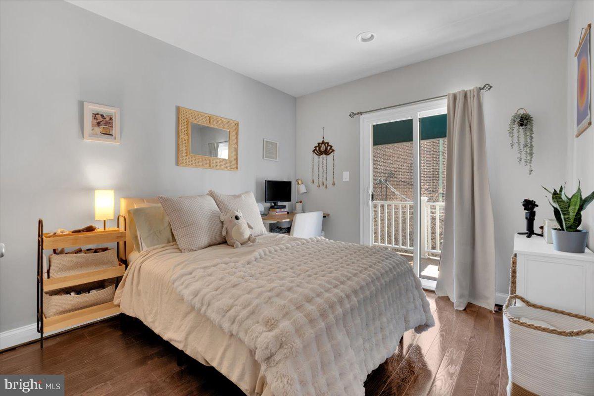 1614 15th Street Northwest Washington, DC 20009 - Photo 25 of 47 a bedroom with a bed and a view of kitchen