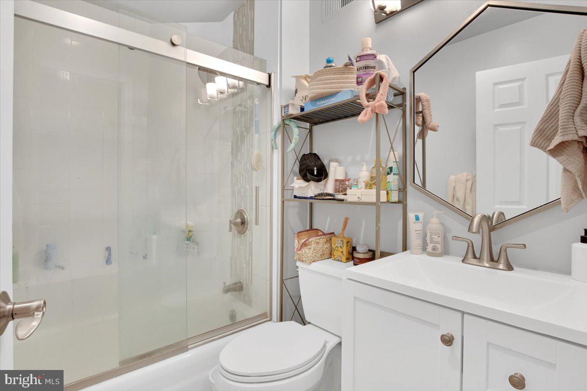 1614 15th Street Northwest Washington, DC 20009 - Photo 30 of 47 a bathroom with a sink toilet vanity and shower