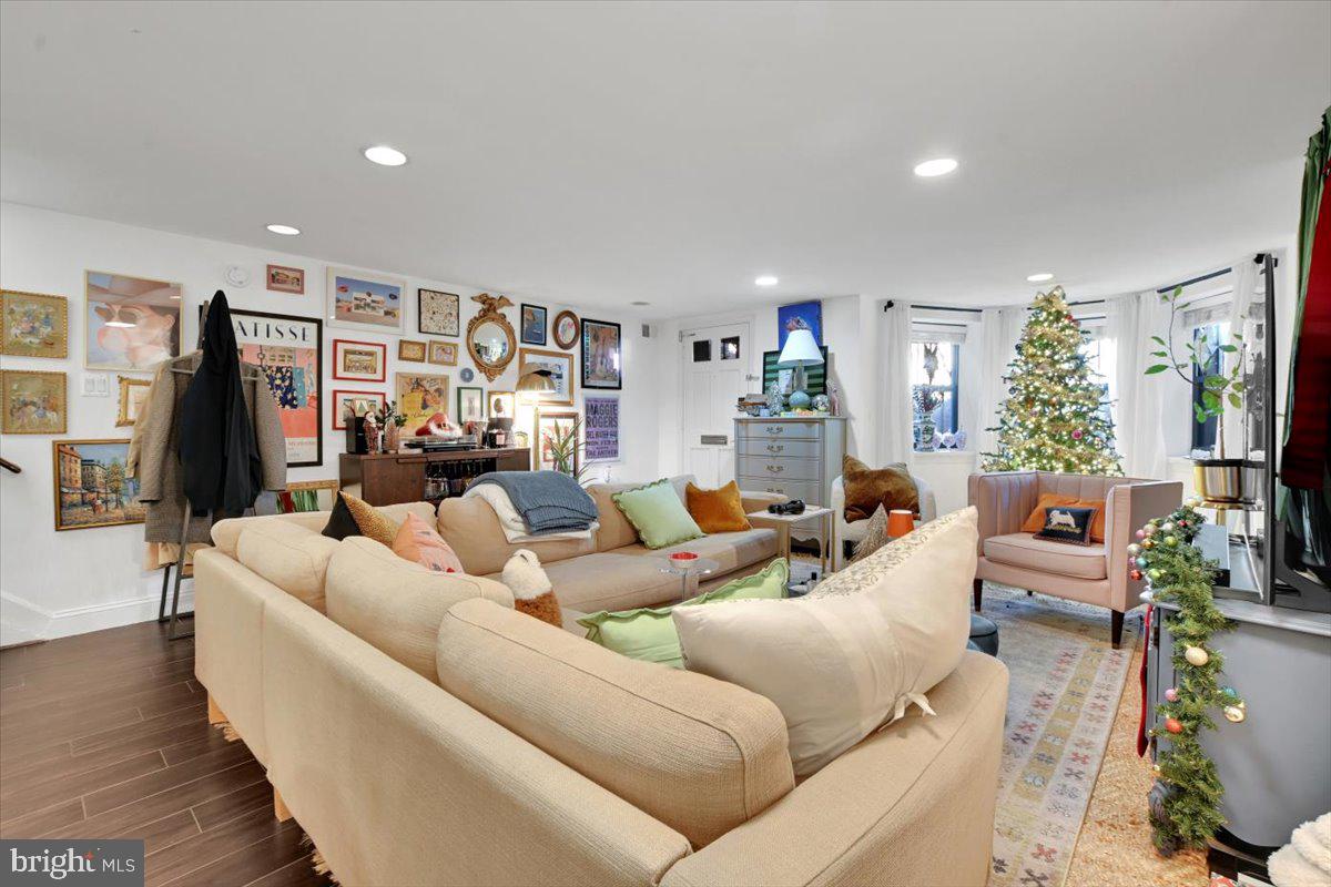 1614 15th Street Northwest Washington, DC 20009 - Photo 34 of 47 a living room with furniture and a flat screen tv