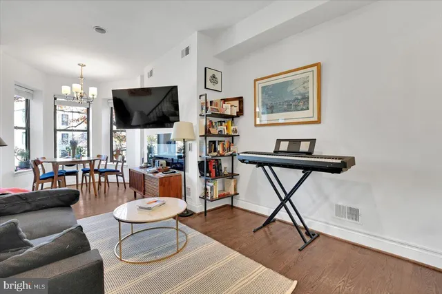 a living room with furniture and a table