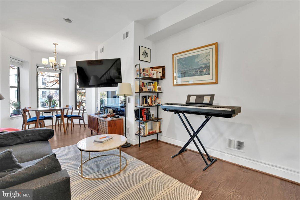 1614 15th Street Northwest Washington, DC 20009 - Photo 5 of 47 a living room with furniture and a flat screen tv