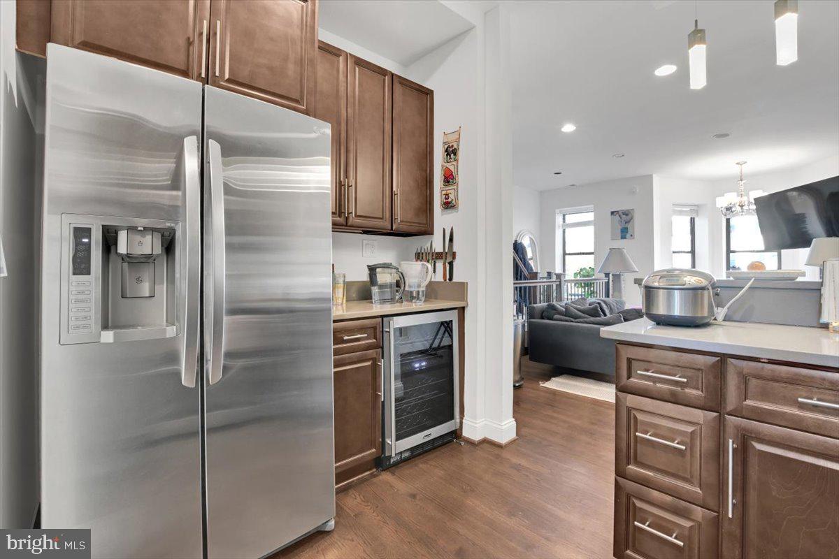 1614 15th Street Northwest Washington, DC 20009 - Photo 8 of 47 a kitchen with stainless steel appliances granite countertop a refrigerator a sink and white cabinets