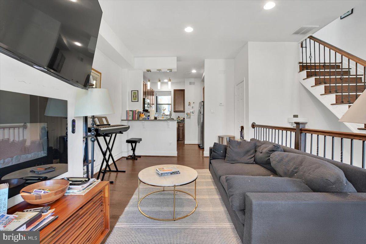 1614 15th Street Northwest Washington, DC 20009 - Photo 10 of 47 a living room with furniture and a flat screen tv