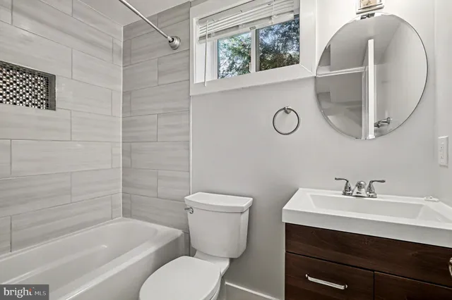 a bathroom with a sink a toilet and a bathtub