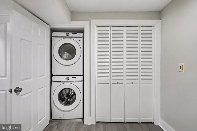 a view of a hallway with washer and dryer