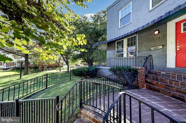 a view of a house with wooden deck
