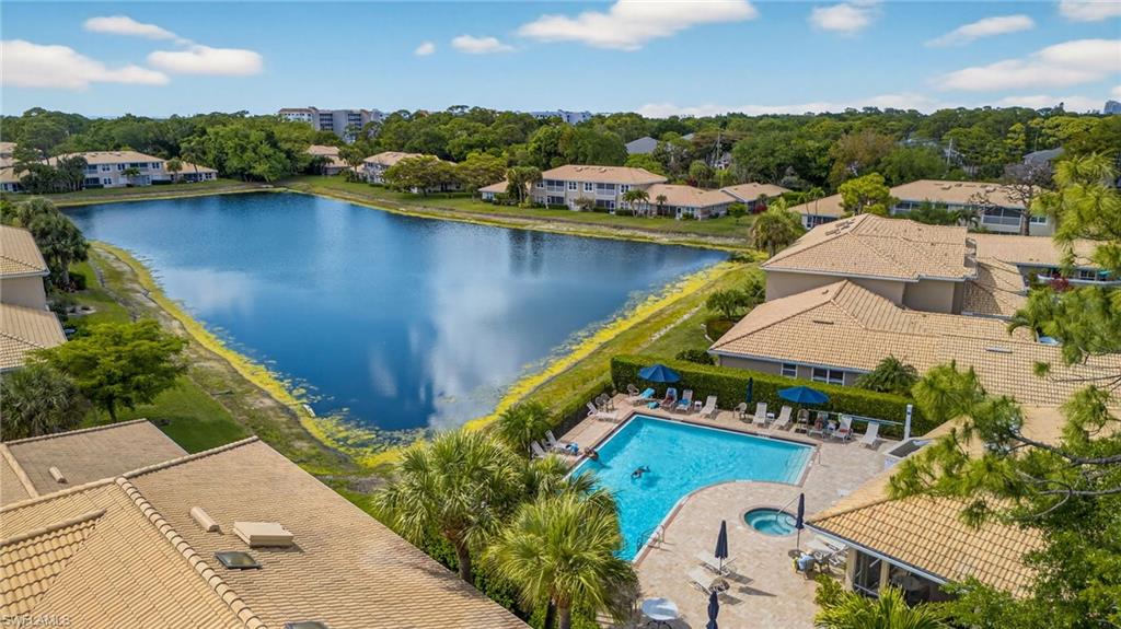 290 Emerald Bay Circle, Unit L7 Naples, FL 34110 - Photo 21 of 22 an aerial view of a house with a lake view