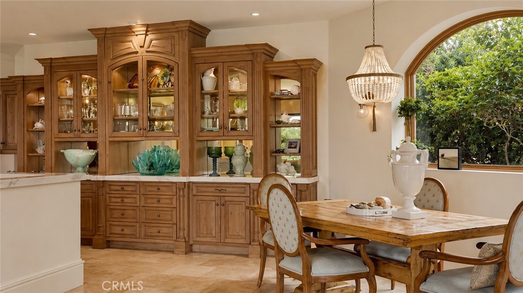 26 Ritz Cove Drive Dana Point, CA 92629 - Photo 21 of 66 a view of a dining room with furniture and chandelier