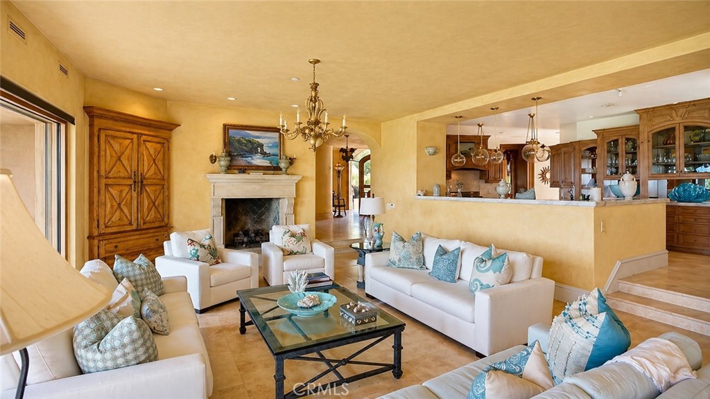 26 Ritz Cove Drive Dana Point, CA 92629 - Photo 32 of 66 a living room with furniture and a fireplace