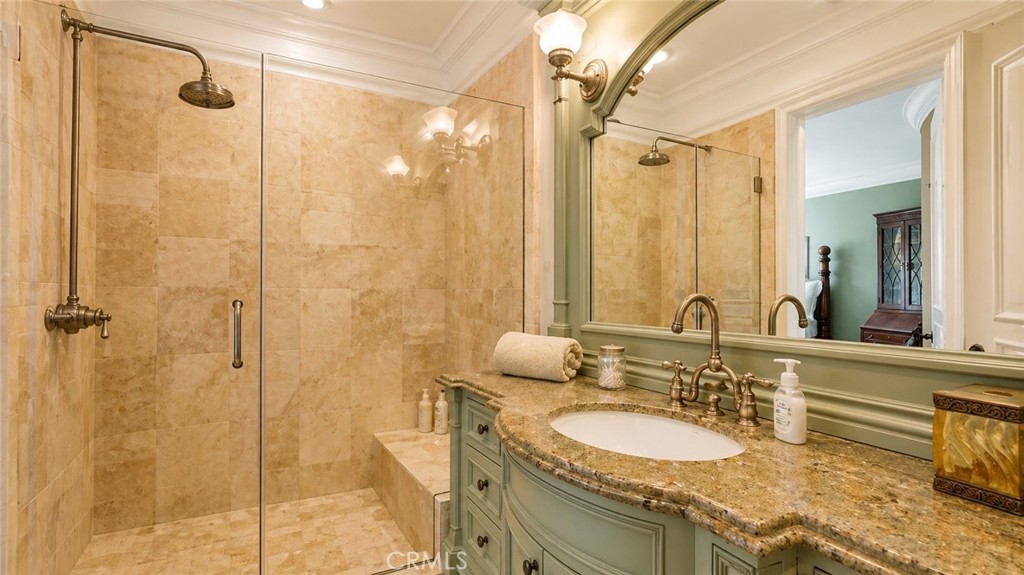 26 Ritz Cove Drive Dana Point, CA 92629 - Photo 51 of 66 a bathroom with a granite countertop sink a mirror a vanity and a shower