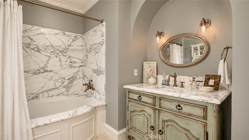 26 Ritz Cove Drive Dana Point, CA 92629 - Photo 56 of 66 a bathroom with a granite countertop sink mirror vanity and a bathtub