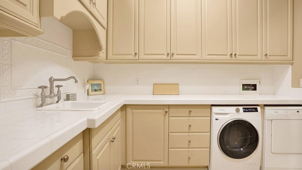 26 Ritz Cove Drive Dana Point, CA 92629 - Photo 59 of 66 a utility room with sink dryer and washer