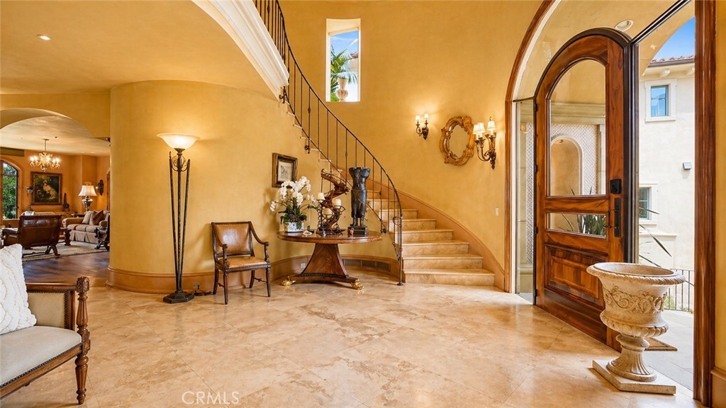 26 Ritz Cove Drive Dana Point, CA 92629 - Photo 6 of 66 Two story Foyer with Large area open to second floor. Custom Front door of Solid Walnut and Glass.
