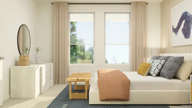 a bed sitting in a bedroom next to a window