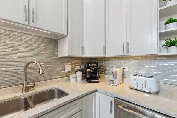 a kitchen with a sink and cabinets