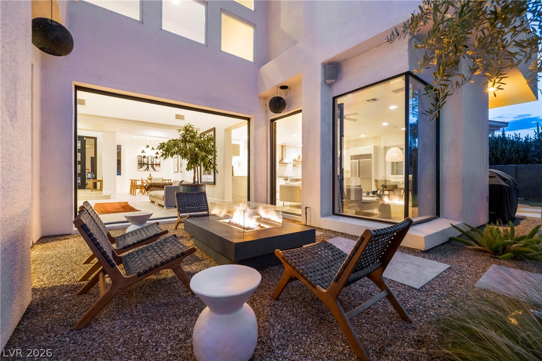 2000 Grouse Street Las Vegas, NV 89134 - Photo 65 of 89 An inviting outdoor living space features a modern fire pit, perfect for evening gatherings.