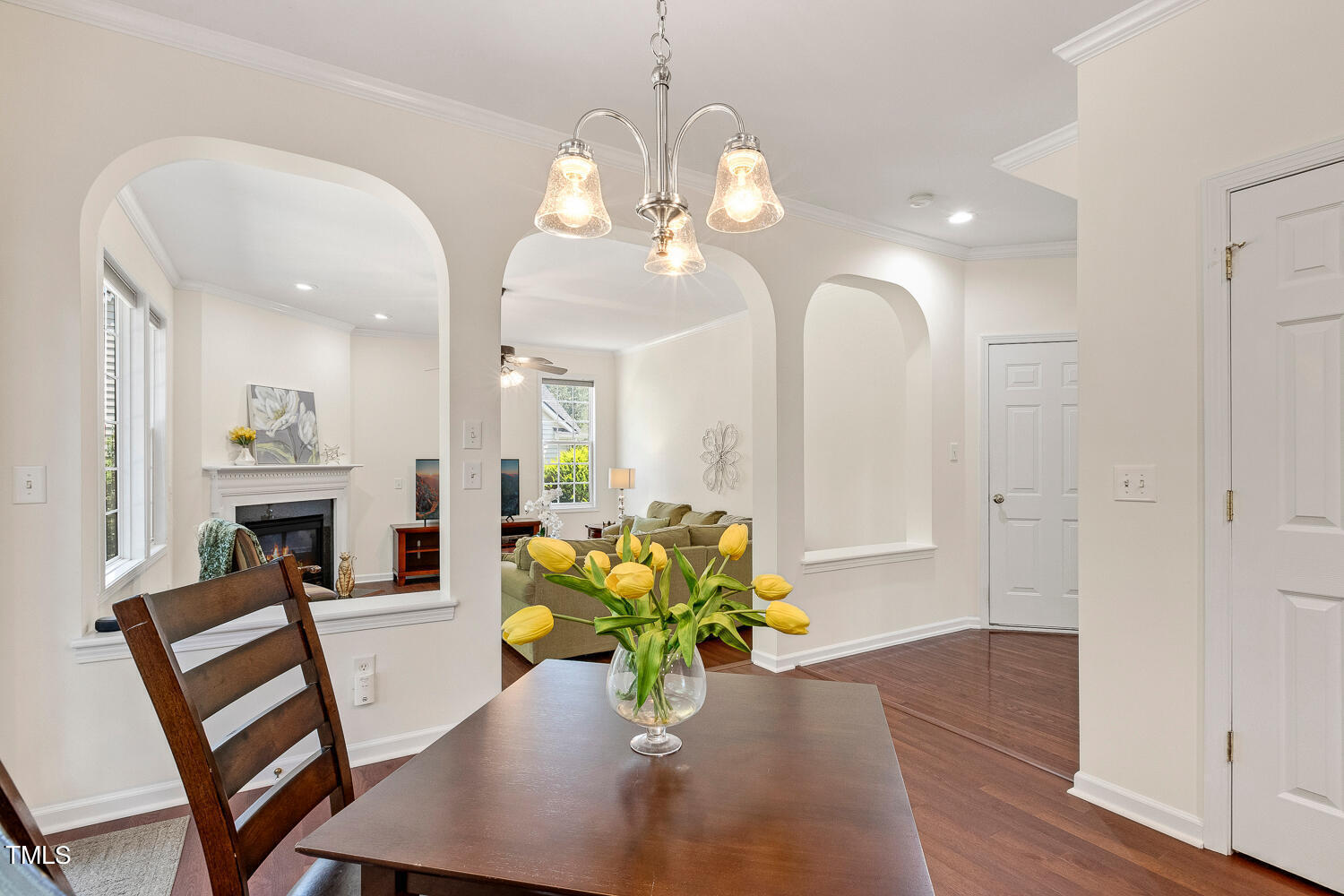 2013 Prairie Ridge Court Fuquay-Varina, NC 27526 - Photo 12 of 53 a view of a dining room with furniture and a chandelier