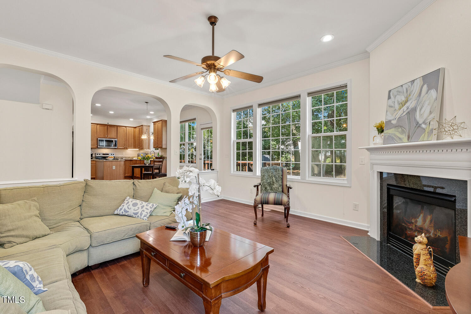 2013 Prairie Ridge Court Fuquay-Varina, NC 27526 - Photo 13 of 53 a living room with furniture a fireplace and a large window