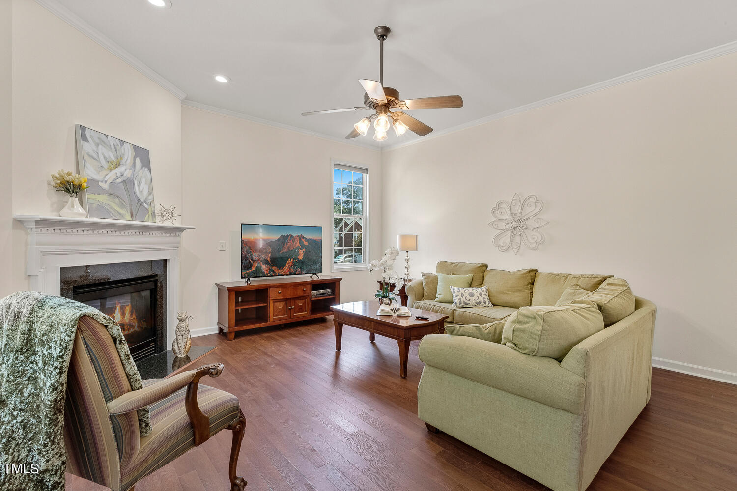 2013 Prairie Ridge Court Fuquay-Varina, NC 27526 - Photo 15 of 53 a living room with furniture and a fireplace