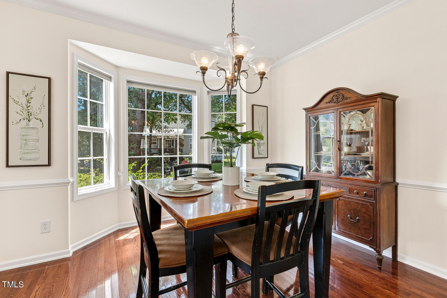 2013 Prairie Ridge Court Fuquay-Varina, NC 27526 - Photo 18 of 53 a view of a dining room with furniture window and wooden floor