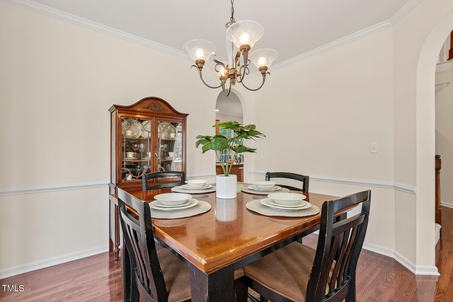 2013 Prairie Ridge Court Fuquay-Varina, NC 27526 - Photo 19 of 53 a view of a dining room with furniture wooden floor and chandelier