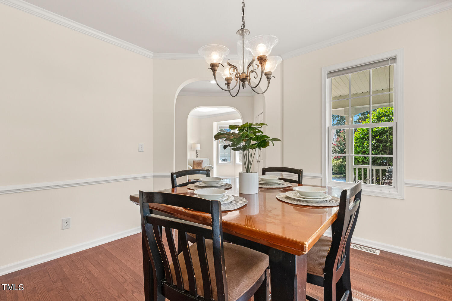 2013 Prairie Ridge Court Fuquay-Varina, NC 27526 - Photo 20 of 53 a view of a dining room with furniture a chandelier and wooden floor