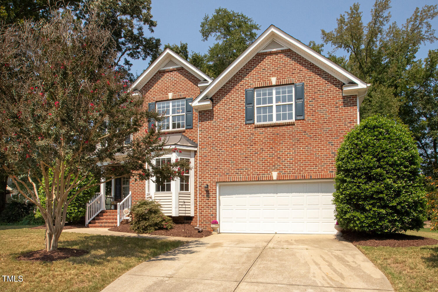 2013 Prairie Ridge Court Fuquay-Varina, NC 27526 - Photo 2 of 53 a front view of a house with a yard and garage