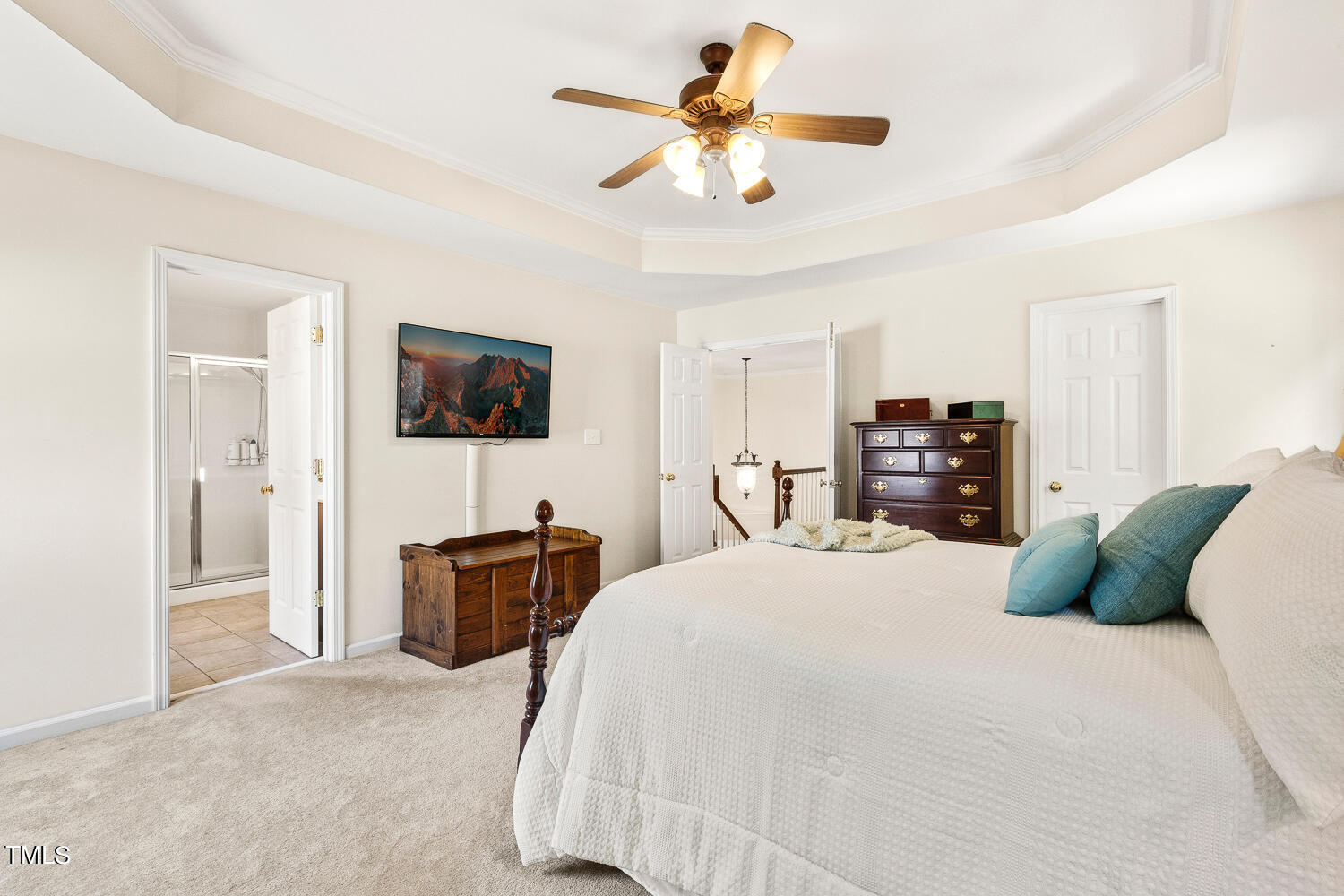 2013 Prairie Ridge Court Fuquay-Varina, NC 27526 - Photo 28 of 53 a bedroom with a bed and a chandelier